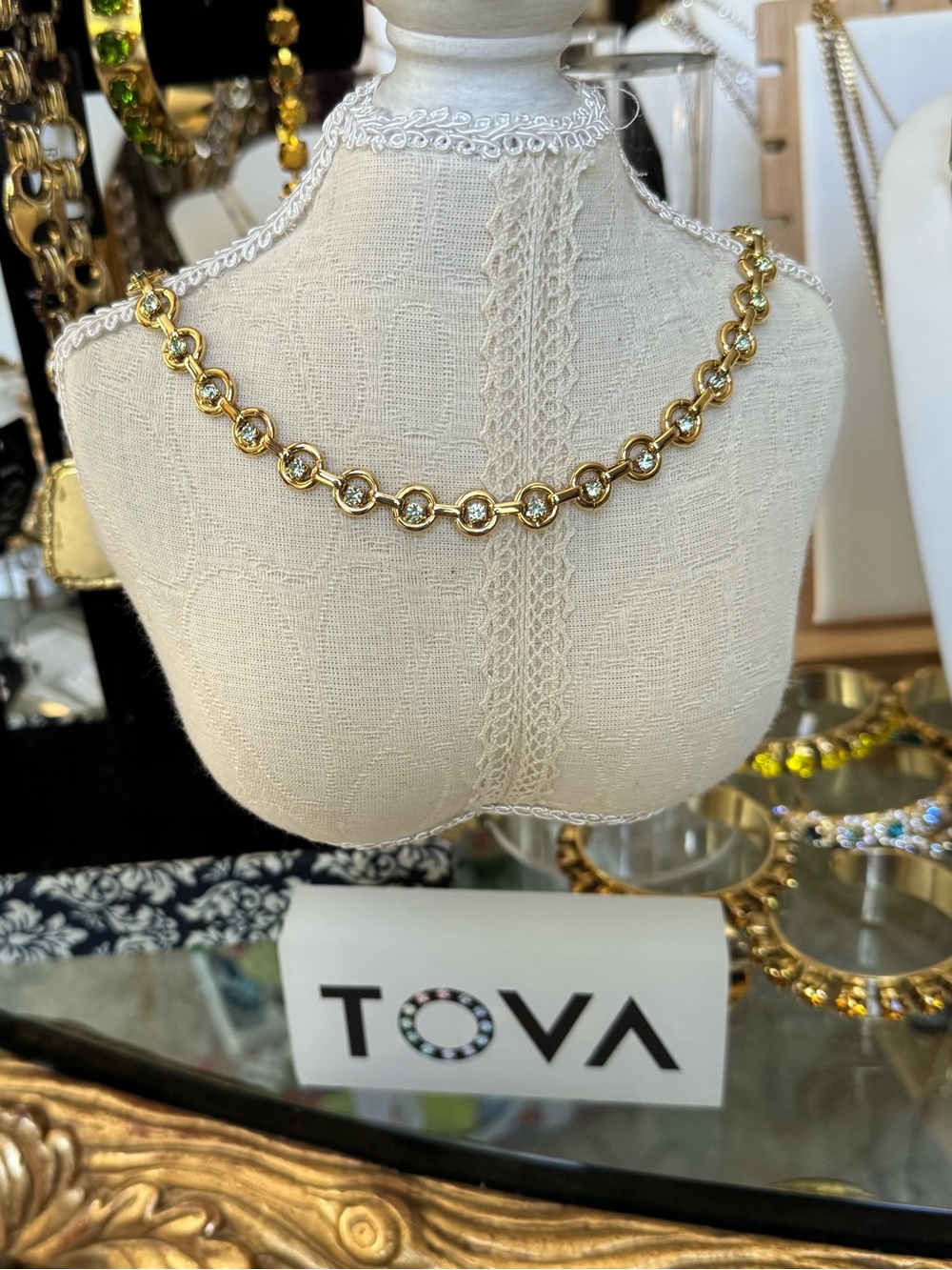 TOVA Gold Crystal Link Necklace with mint crystals.